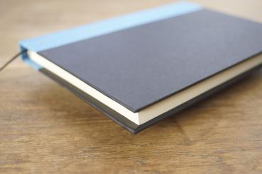 Writing and notebook black, with light blue linen